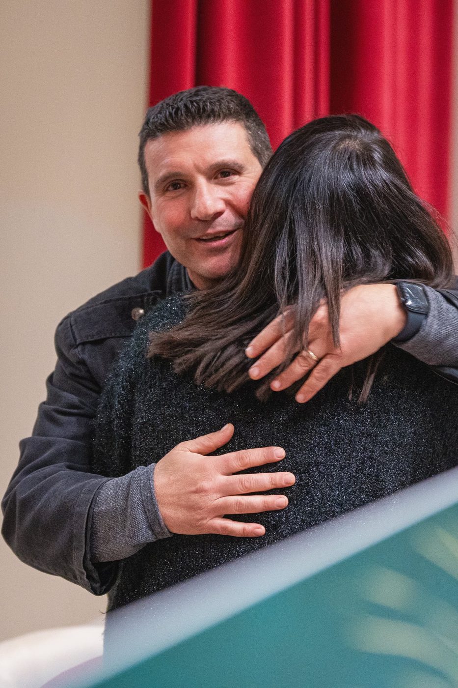 A hug at the end of a meeting